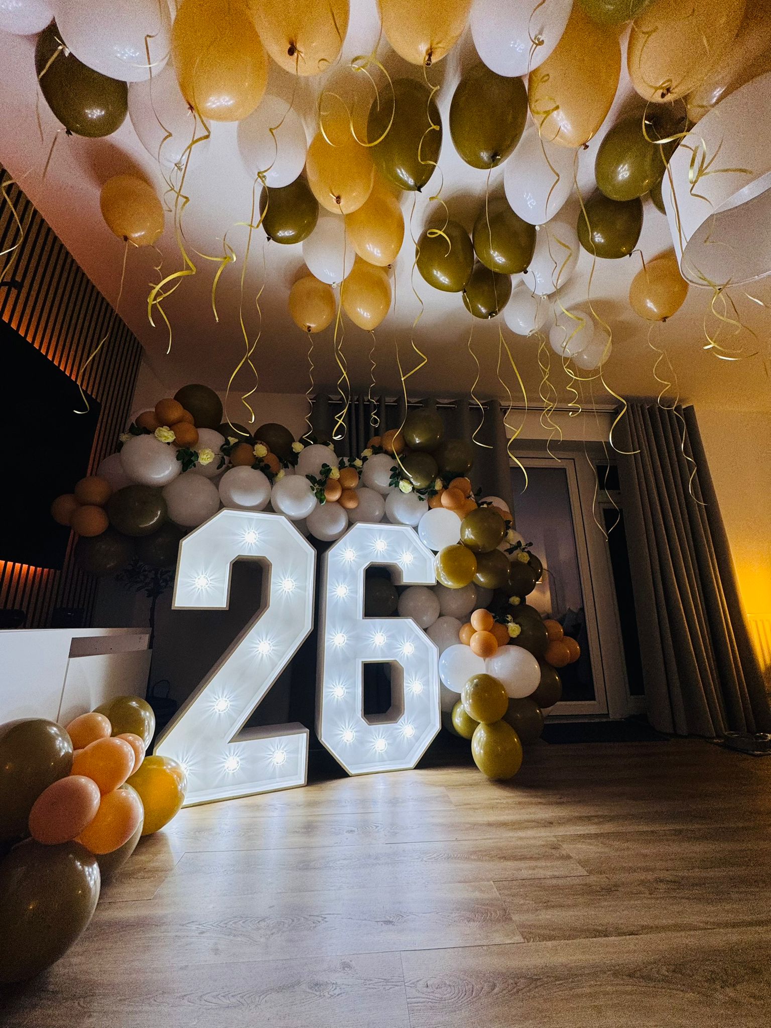 Number 26 display in ballons and flowers