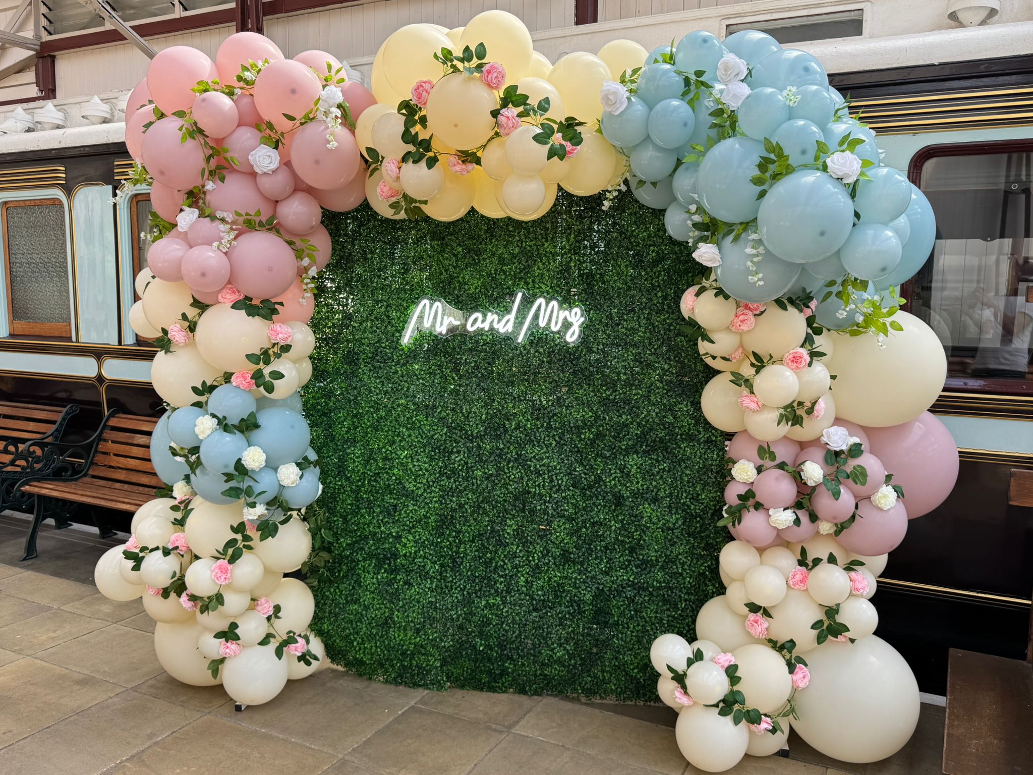 Elegant wedding backdrop with balloons and florals